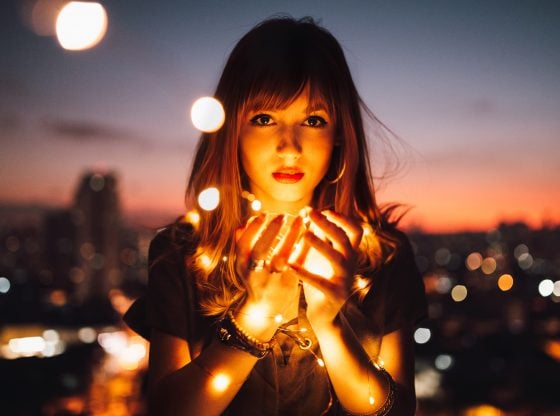 woman holding lights