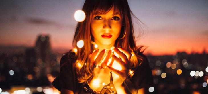 woman holding lights