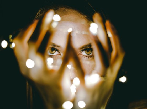 womans eyes between lights