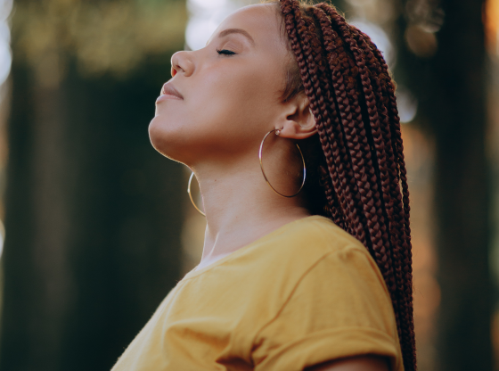 woman with eyes closed meditating