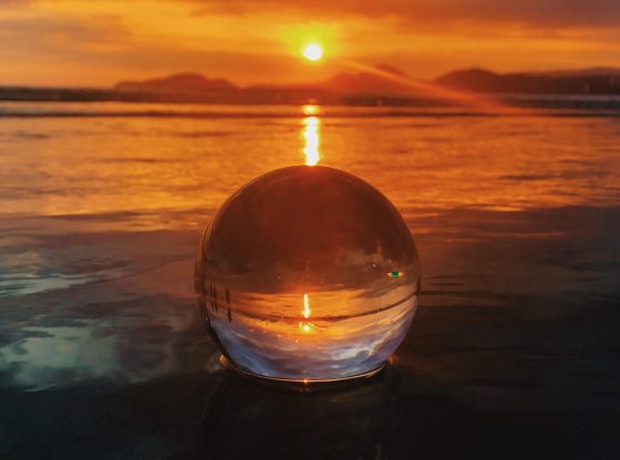 crystal ball in the water at sunset