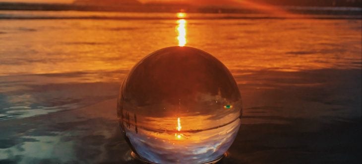 crystal ball in the water at sunset