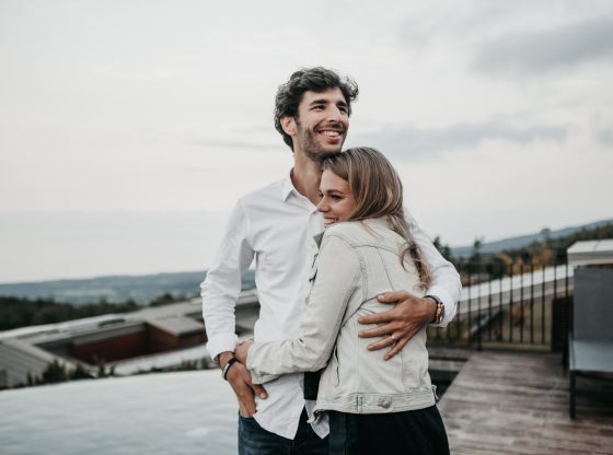 happy man and woman embracing