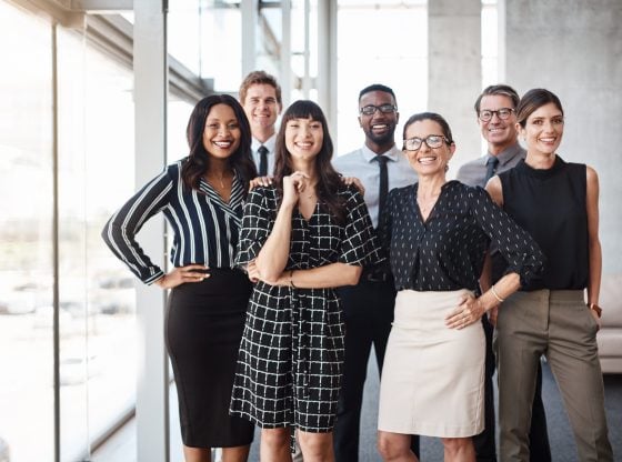 Shot of a group of well-dressed businesspeople standing together