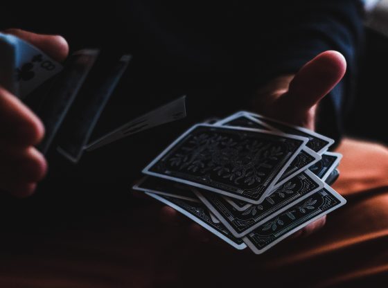 hands shuffling tarot cards