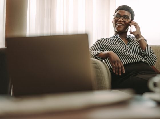 Business woman smiling and talking on the phone