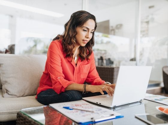 Latina woman on laptop