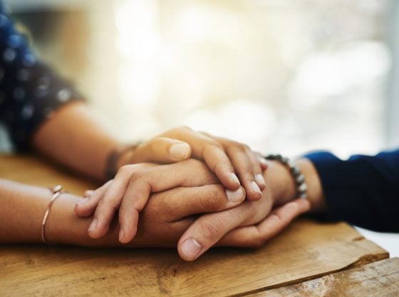 hands touching in a spiritual connection